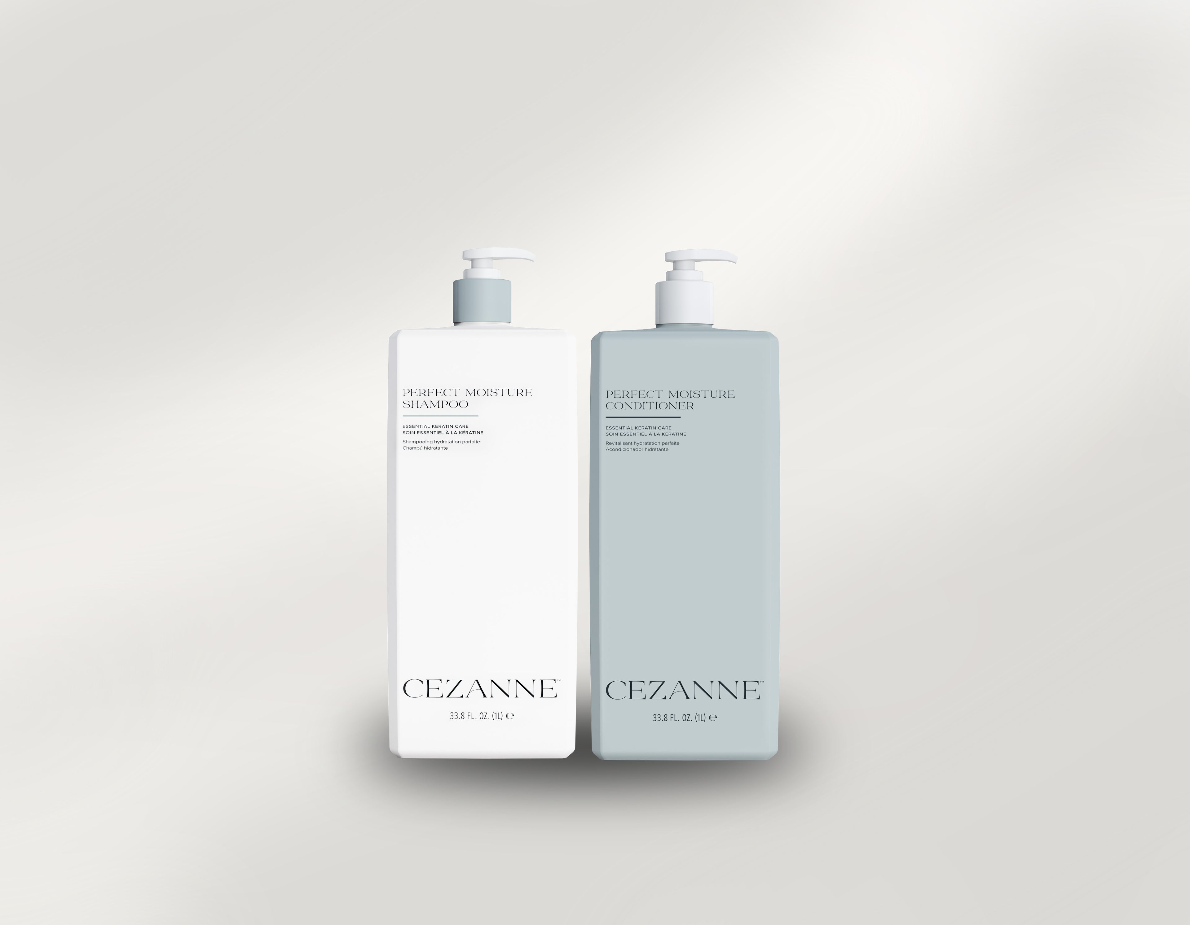Two bottles of Cezanne Perfect Moisture Shampoo and Conditioner on a light gray background
